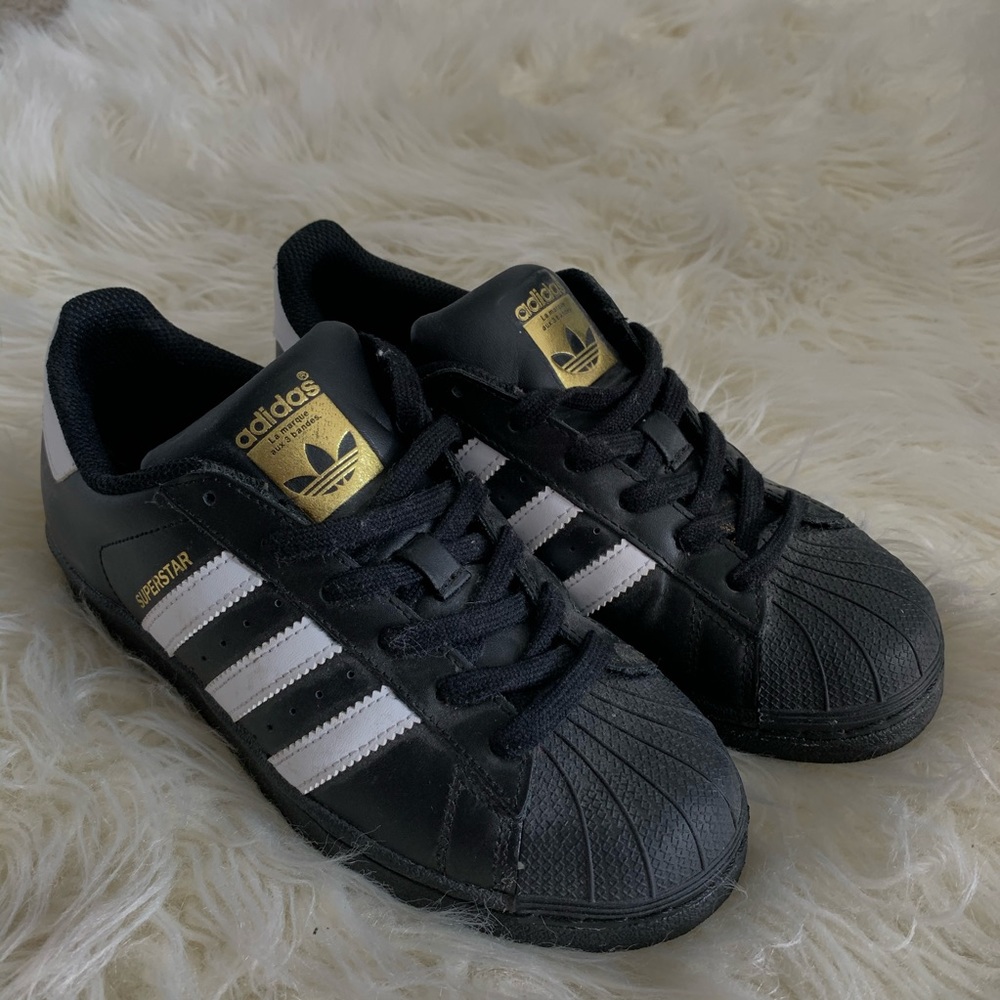 Black Adidas Superstar shoes